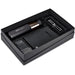 An open premium giftset mostly in black containing a bottle, pen-set, mobile power bank charger and notebook.