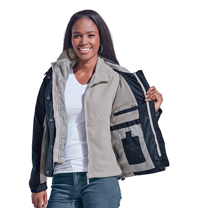 Smiling front-facing attractive female model showing different jacket layers by holding one side of the jacket open